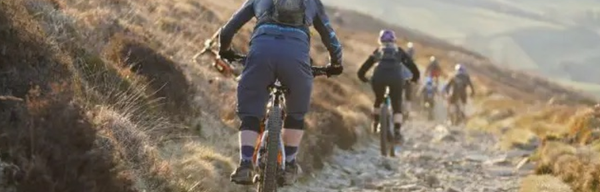 Bikes descending a path near Ladybower