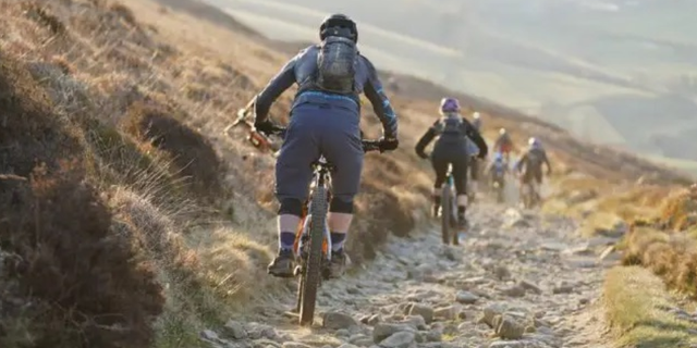 Bikes descending a path near Ladybower